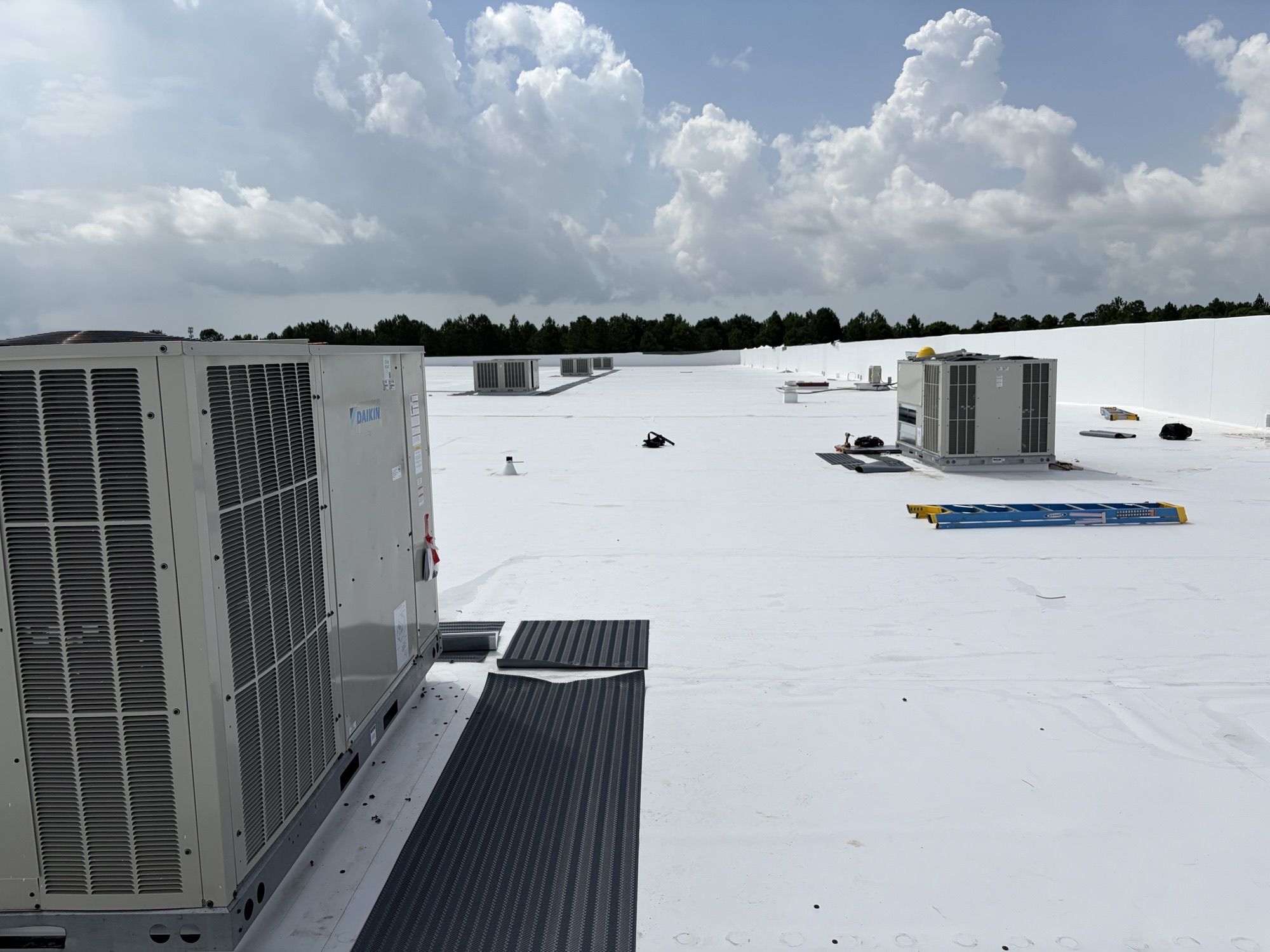 Large commercial Daikin rooftop AC units installed on Amazon warehouse